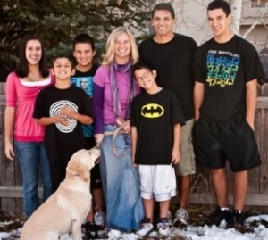 The Escobars: Jose with his wife, Kathy, their five kids and their yellow lab.