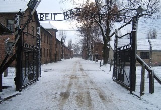 The entrance to the concentration camp Auschwitz I reads "Arbeit macht frei" -- "Work makes (one) free." (Wikimedia Commons)