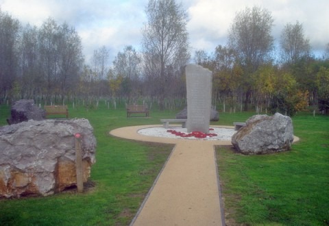 The Ulster Ash Grove's Weeping Ash trees pay tribute to those who lost their lives in the cause of peace in Northern Ireland. The pillar at the center is surrounded by stone blocks quarried from each of the six counties of Northern Ireland. (Trevor Rickard, Wikimedia Commons)